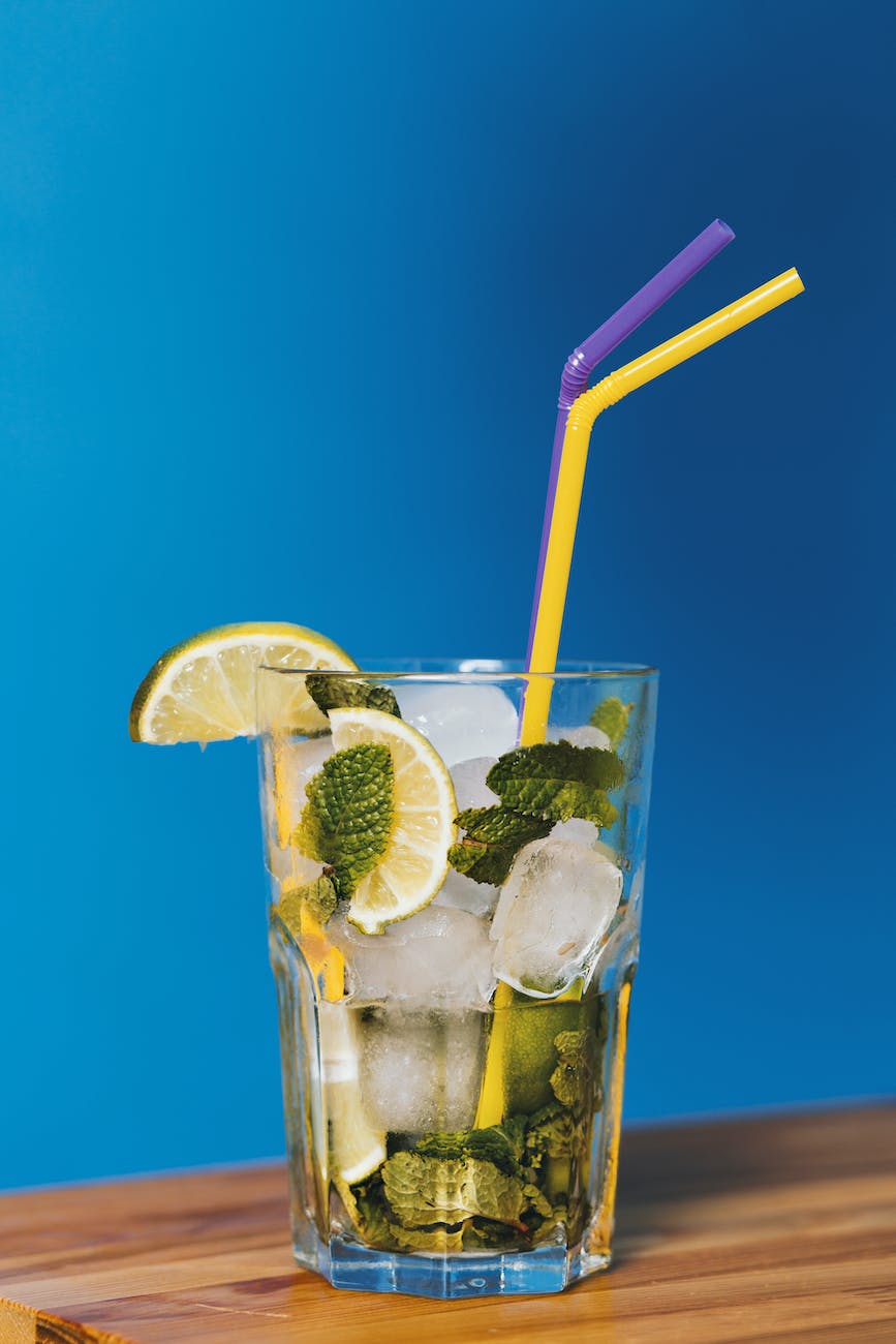 lime cocktail drink with two straws